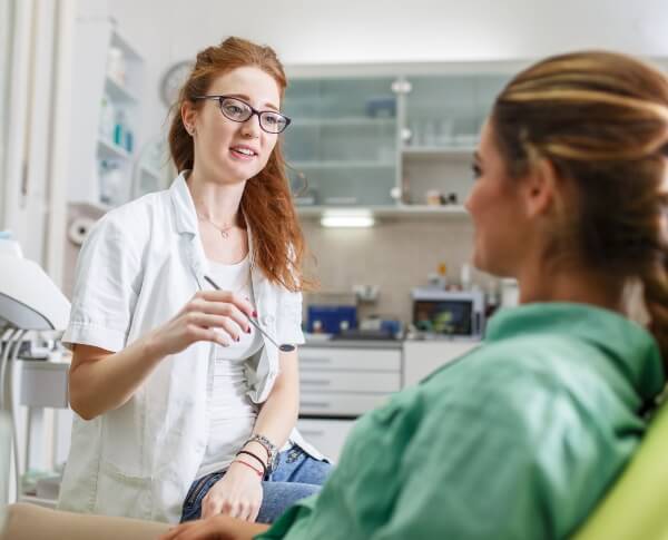 Oral surgery patient talking to team member