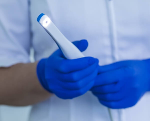 Dentist holding an intraoral camera