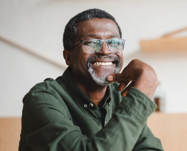 Man smiling after all on four dental implant placement