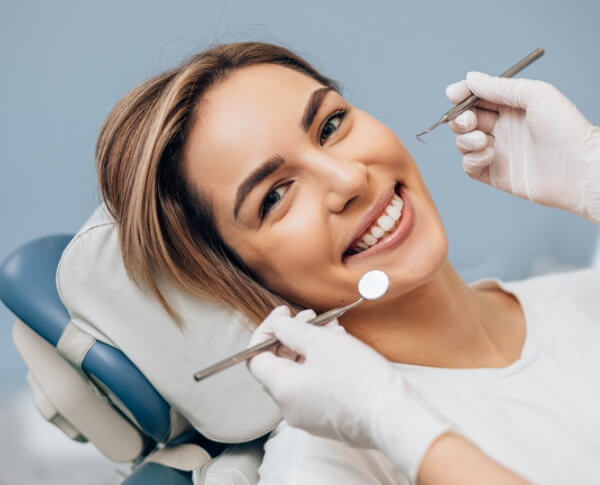 Woman smiling during a dental implant consultation
