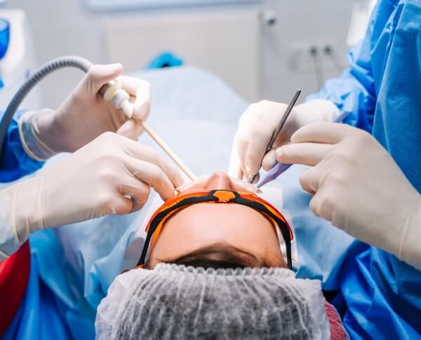 Patient receiving surgical tooth extraction