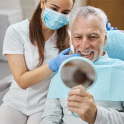  a patient following dental implant post-op instructions in Coppell