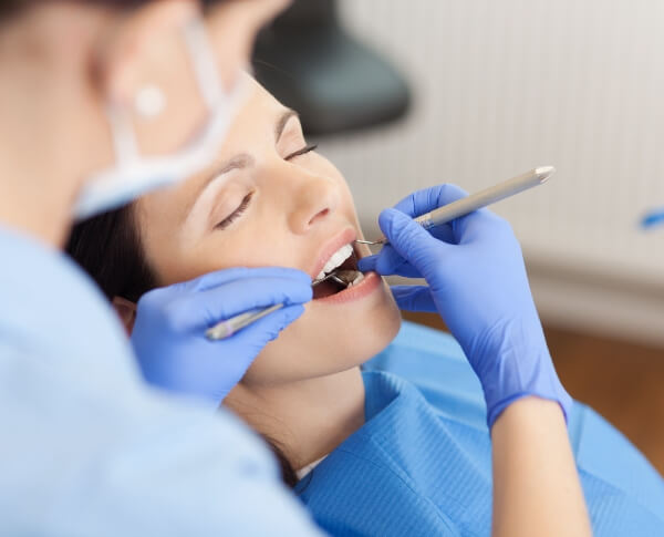 Patient receiving treatment under oral conscious dental sedation
