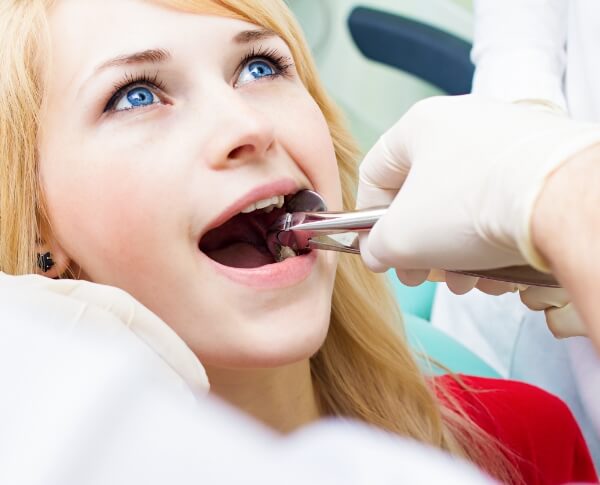 Patient having wisdom tooth extracted