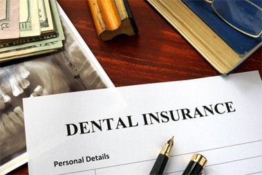 a dental insurance form on a desk
