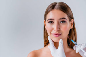 Woman receiving cosmetic injection