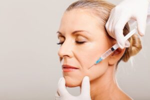 Woman getting BOTOX near her mouth